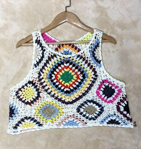 Colorful handmade crochet crop top with bohemian floral patterns for plus size women
