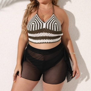 Detail of plus size crochet halter top and sheer mesh beach shorts with elastic waist