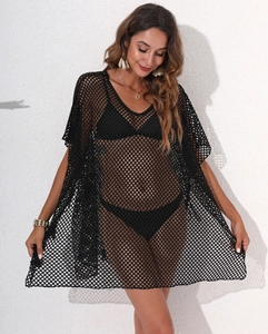 Detail of sexy black mesh crochet beach dress with deep V-neck and batwing sleeves