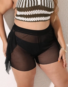 Detail view of plus size black mesh sheer shorts with stylish ruffled hem and crochet top