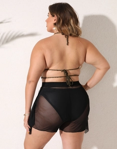Plus size beach set featuring dark green crochet halter top and black mesh sheer skirt