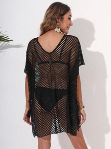 Detailed back view of a black mesh beach cover-up with large hole texture and loose fit