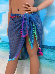 Blue crochet beach sarong skirt with multi-color pom poms and metallic disk details