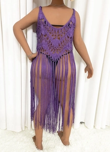 Detail of purple crochet cover-up dress featuring geometric hollow patterns and long tassels