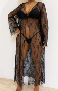Détails du haut de plage en dentelle noire transparente avec liens à franges et ourlet fin