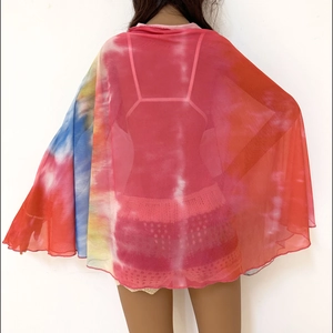 Detailed back view of a sheer red tie-dye mesh beach cover-up wrap for women