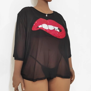 Detail of red sequined lips on sheer black mesh oversized T-shirt for women