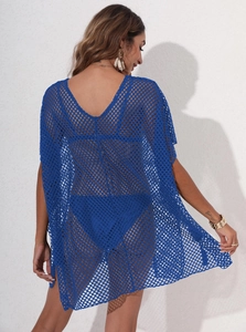 Detail of dark blue crochet beach cover-up with hollow diamond mesh pattern