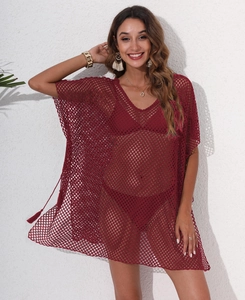 Detail view of burgundy mesh crochet beach cover-up with stylish side tassel accents