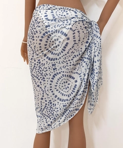 Detailed view of the blue and white polka dot sarong featuring a lightweight tie-up waist