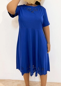 Detailed laser-cut hollow floral pattern on the hem of a royal blue plus size dress
