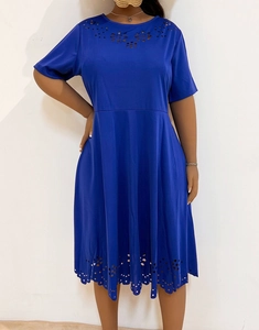 Detail of laser-cut floral hollow pattern on the neckline of a royal blue short sleeve dress