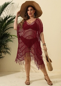 Detail of wine red crochet beach cover-up with hollow knit patterns and fringe hem