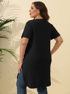 Side view of long black plus size T-shirt featuring deep side slits and high-low hem