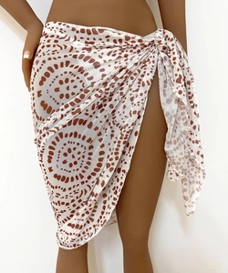 Close-up of semi-transparent mesh sarong with brown abstract dots and side tie closure