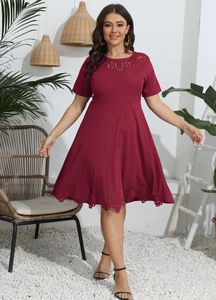 Detail of laser-cut floral patterns on wine red plus size short sleeve A-line dress
