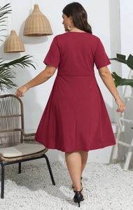 Detail of a burgundy plus size short sleeve dress with high waist and A-line skirt