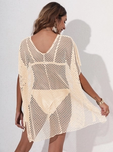 Detail of crochet hollow beach cover-up with open mesh texture and back view design