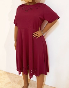 Detailed laser-cut floral cutouts on the neckline and hem of the wine red midi dress
