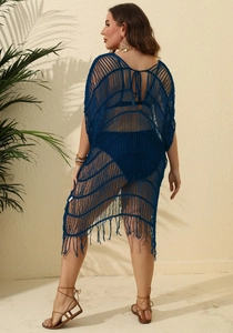 Detail view of the back ties and fringe hem on this navy blue crochet beach cover-up