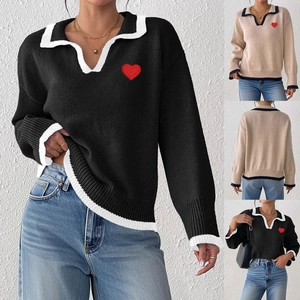 Detail of color-block knit sweater featuring lapel collar and heart embroidery patch