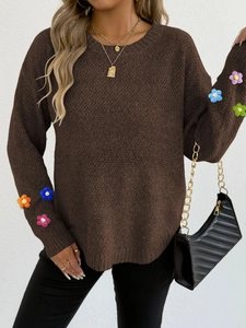 Brown long-sleeve knit sweater featuring colorful 3D handmade crochet flower patches