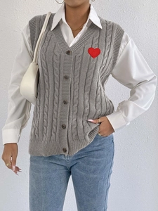 Women's grey cable knit vest with red heart patch and V-neck button down design