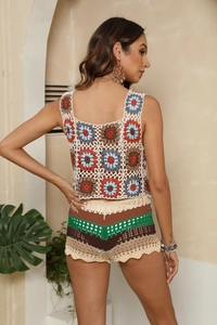 Detailed back view of a colorful crochet knit two-piece set with shorts and halter top