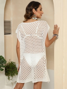Close-up of intricate white crochet knit details on this beach bikini cover-up dress