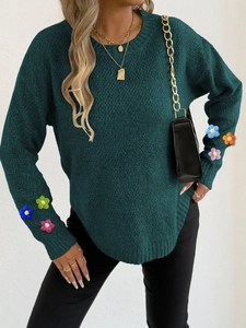 Dark forest green knit sweater with colorful handmade crochet flower sleeves and curved hem