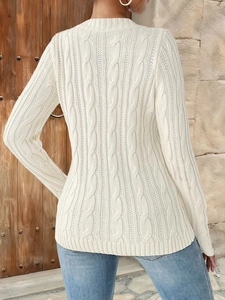 Detailed view of white cable knit sweater back featuring classic texture and slim fit