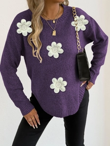 Close-up of 3D white floral appliques and textured knit on dark purple round neck sweater