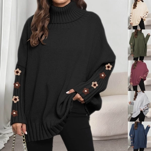 Detailed view of the exquisite 3D floral embroidery on high turtleneck knit sweater sleeves