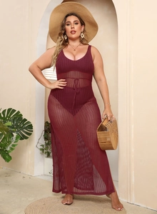 Full body view of a woman in a wine red crochet hollow-out maxi beach dress cover-up
