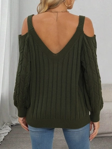 Detail of cable knit patterns and back V-neck on a dark green off-shoulder sweater