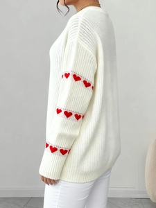 Plus size white knit sweater featuring casual loose fit and red heart embroidery on sleeves