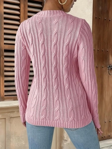 Detailed back view of pink cable knit sweater showing intricate knit texture and slim fit