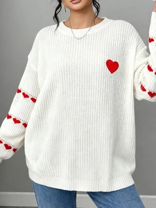 White plus size knit sweater with contrast red heart embroidery and ribbed textures