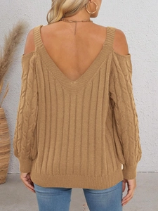 Detail of khaki cable knit sweater featuring a deep V-back and cold shoulder design