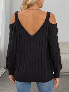 Detail of black cable-knit sweater featuring a cold-shoulder cut and deep V-neck back design