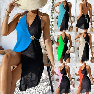 Detail of color-block knit cover-up dress featuring a metallic flower buckle detail