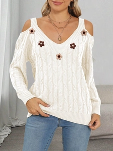 Detail of V-neck cable knit sweater with off-shoulder cutouts and 3D floral appliques