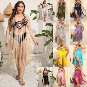 Close-up of bohemian crochet beach cover-ups showing vibrant multicolored geometric patterns