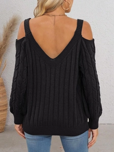 Close-up of cable knit texture and cold shoulder design on back of black sweater