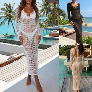 Detail of crochet beach cover-up featuring metal ring accents and sexy lace-up back