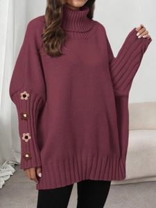 Close-up of burgundy high neck oversized sweater with handmade crochet flower sleeves