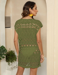 Detail of army green crochet beach cover-up featuring geometric hollow patterns