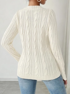 Back view of cream cable-knit sweater showing intricate knit patterns and slim fit