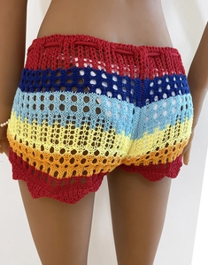 Close-up of rainbow striped crochet shorts with hollow knit patterns and drawstring