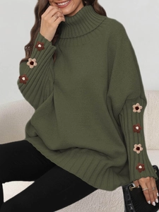 Detailed view of dark green turtleneck sweater with handmade crochet flower sleeves